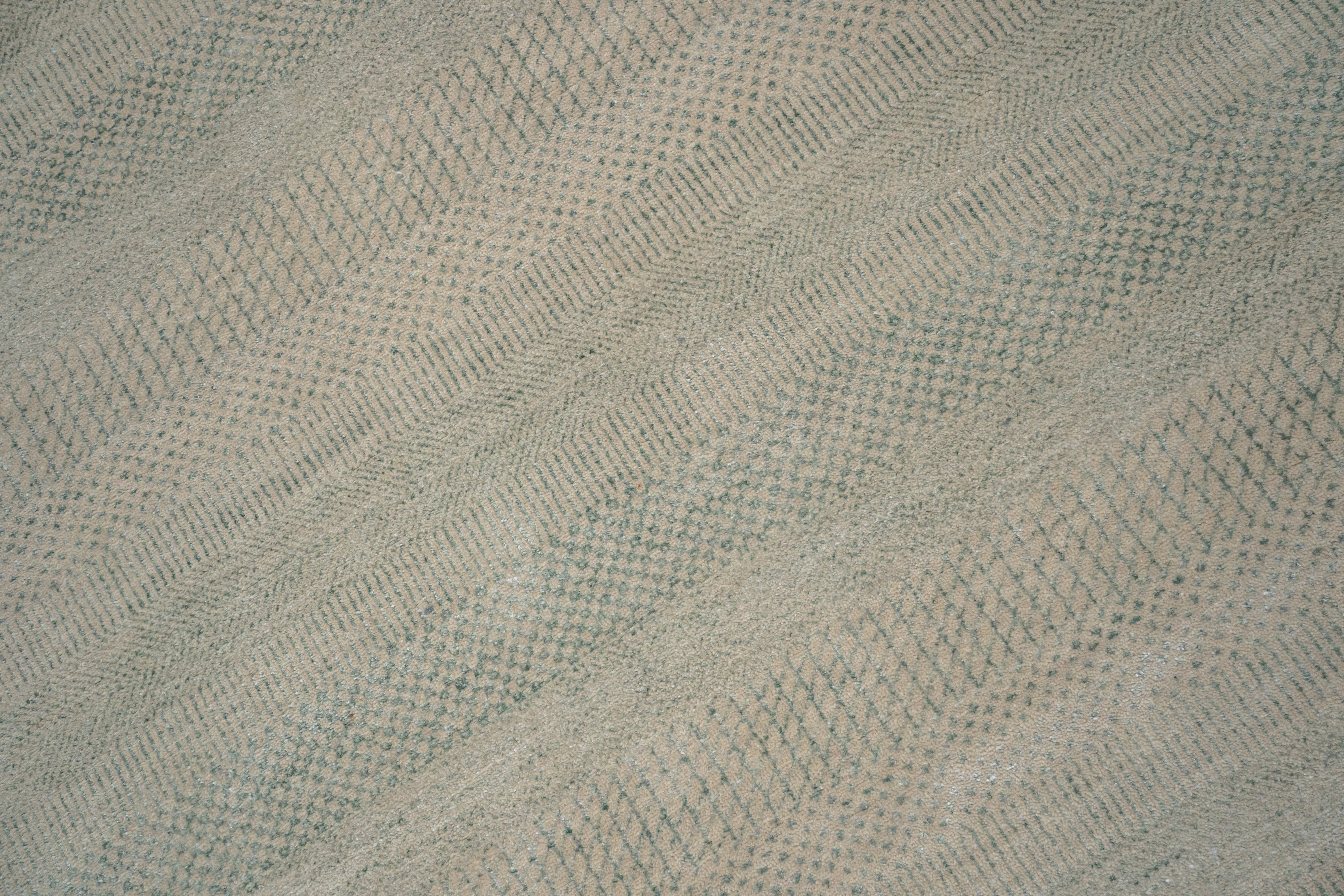 Textured fabric with a herringbone pattern in a neutral color.