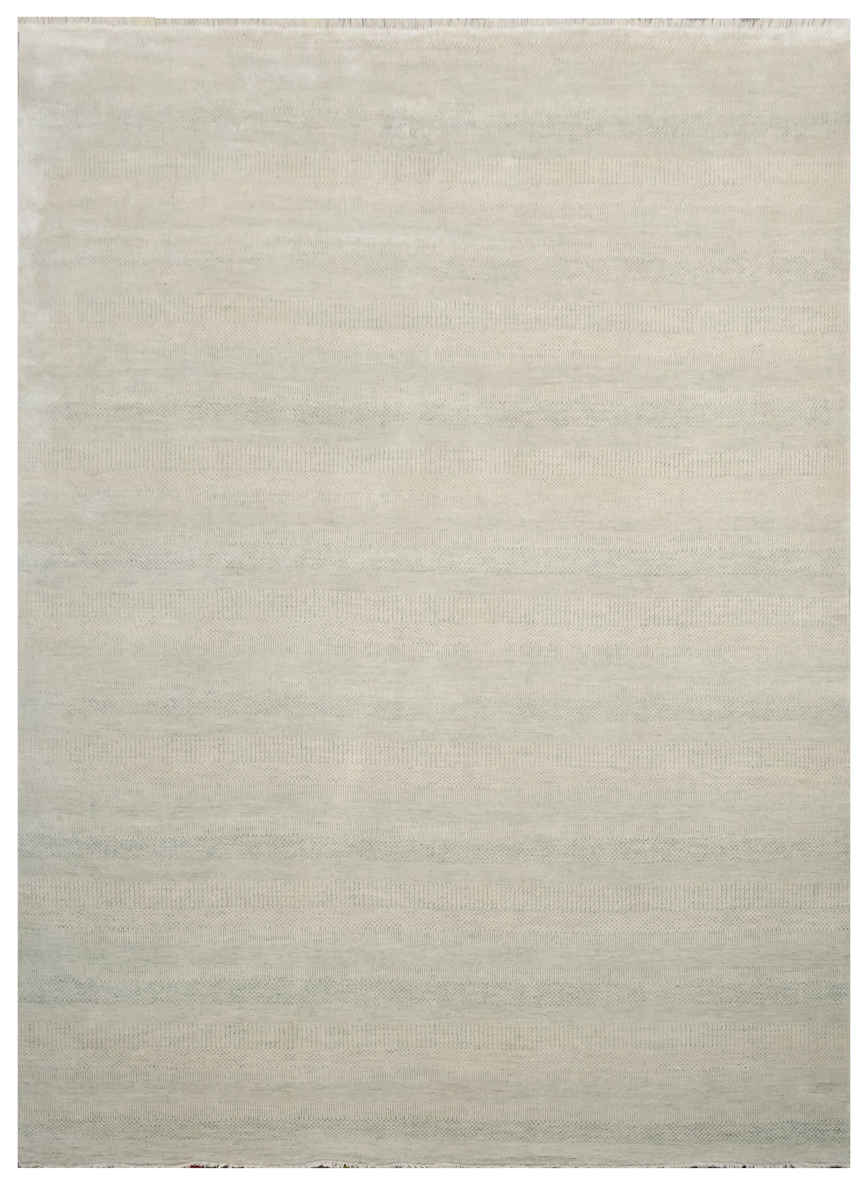 Beige area rug with a subtle pattern on a plain background